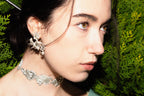 NEXUS earrings worn, displaying unique styling