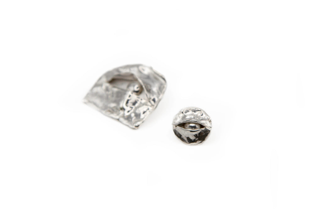 ORBIS hand-carved 925 sterling silver earrings with striking observation design