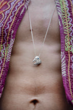 Hand-carved sterling silver TOOTH & TALES pendant. Perfect for those who cherish the tales and experiences of adulthood.