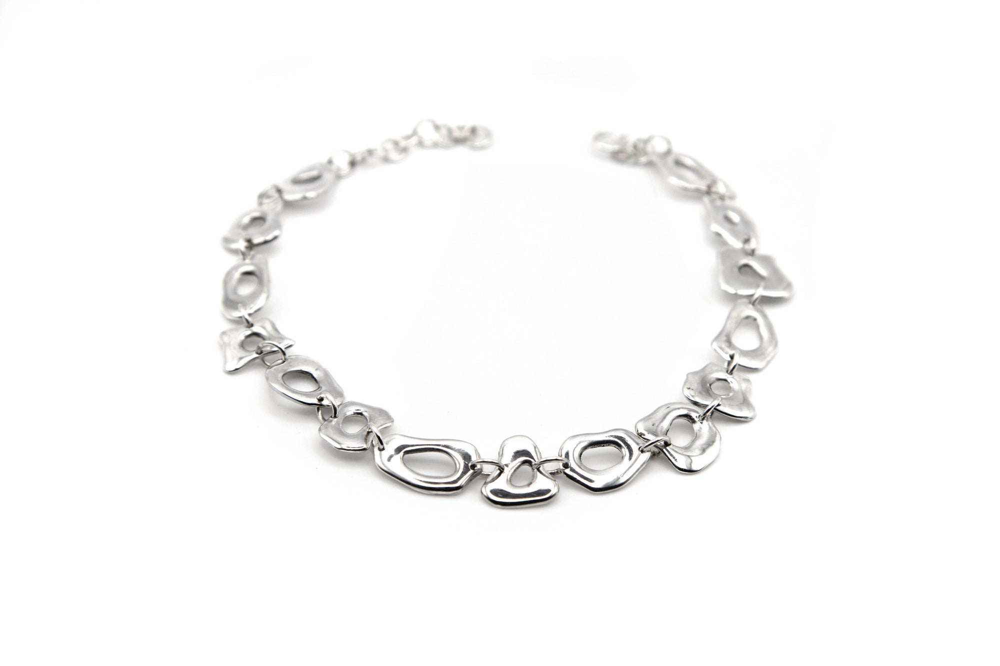 THE PORTAL CHOKER showing abstract interconnected shapes and central openings