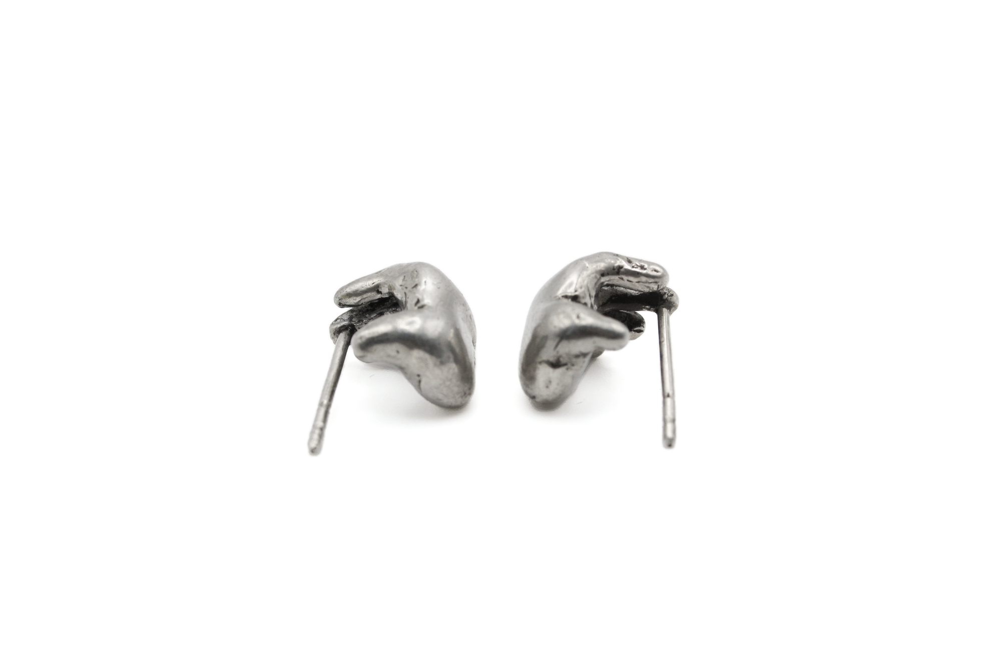 UNION earrings, displaying beacon of peace and global embrace. Little hands, hand-carved.
