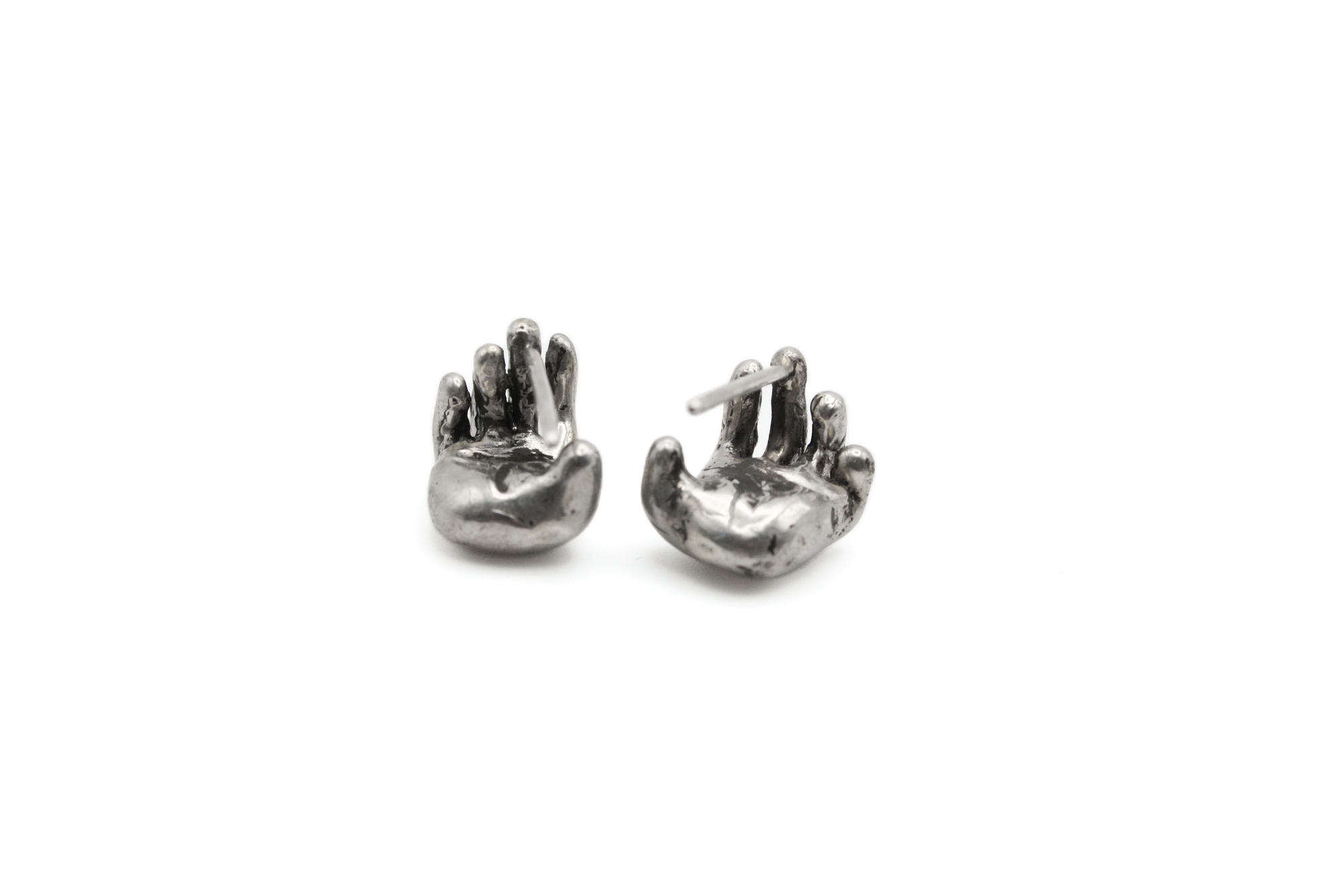 Close-up of UNION earrings showing inclusion and unity design